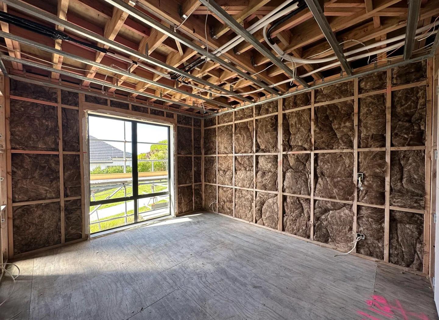 K-frame scaffolding system with orange safety components, showing modular design with interlocking connections and professional assembly